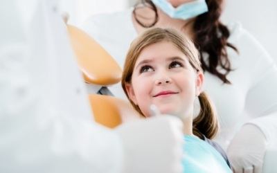 Child smiling during a dental checkup