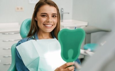 Woman smiling looking in mirror