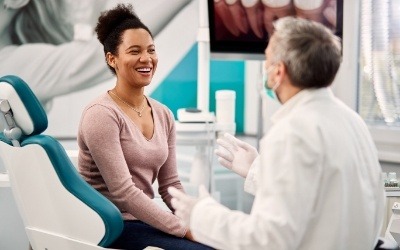 Woman smiling considering cosmetic dentistry