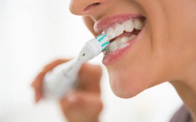 Woman brushing her teeth