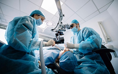 oral surgeons placing a dental implant