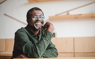 a man sitting and smiling