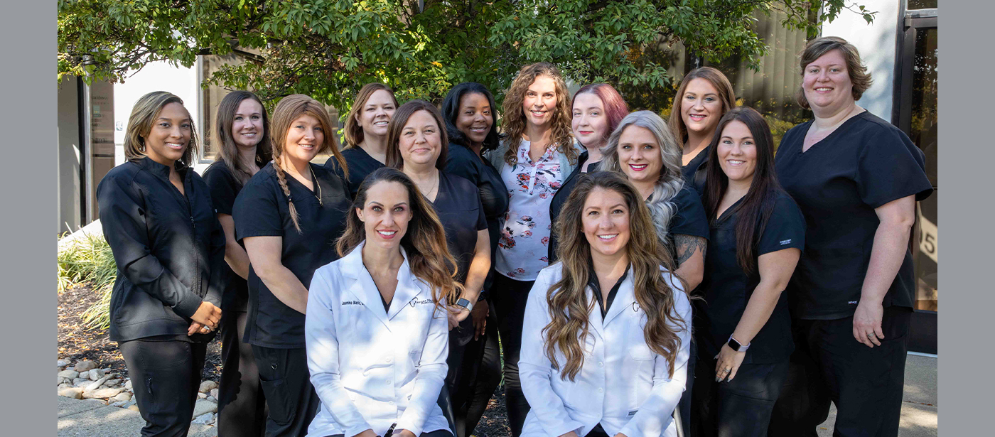 Forest Park Ohio dentists and dental team smiling outdoors