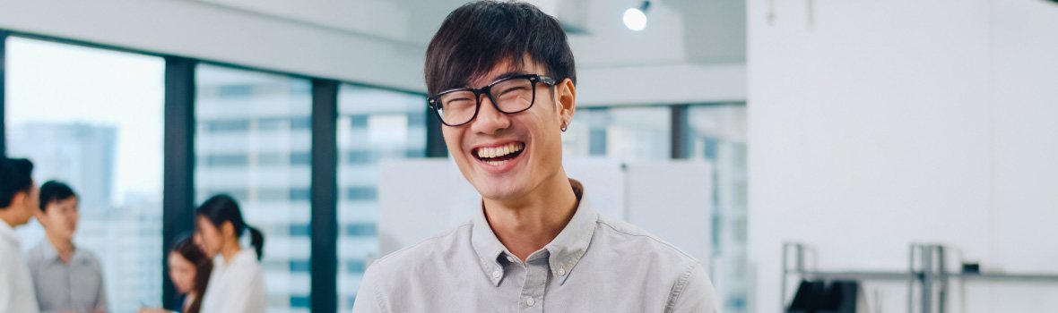 man with glasses smiling