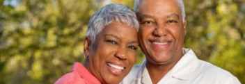 Man smiling after tooth replacement with dental implants