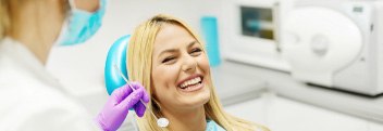 Woman smiling during preventive dentistry visit