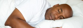 Man sleeping soundly thanks to sleep apnea treatment