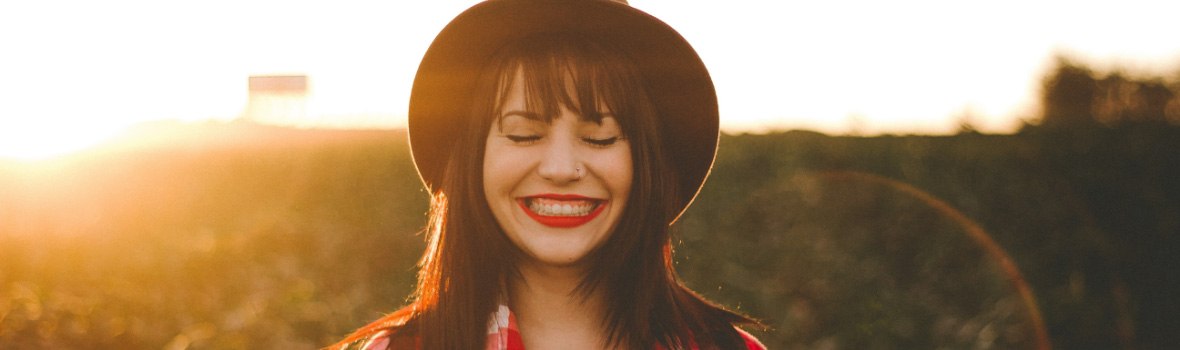 woman in a hat smiling