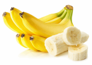 Unpeeled and cut bananas slices on a white background