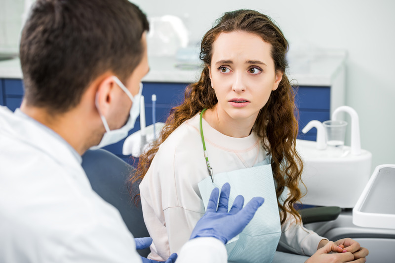 patient looking worried about dental implant sensitivity